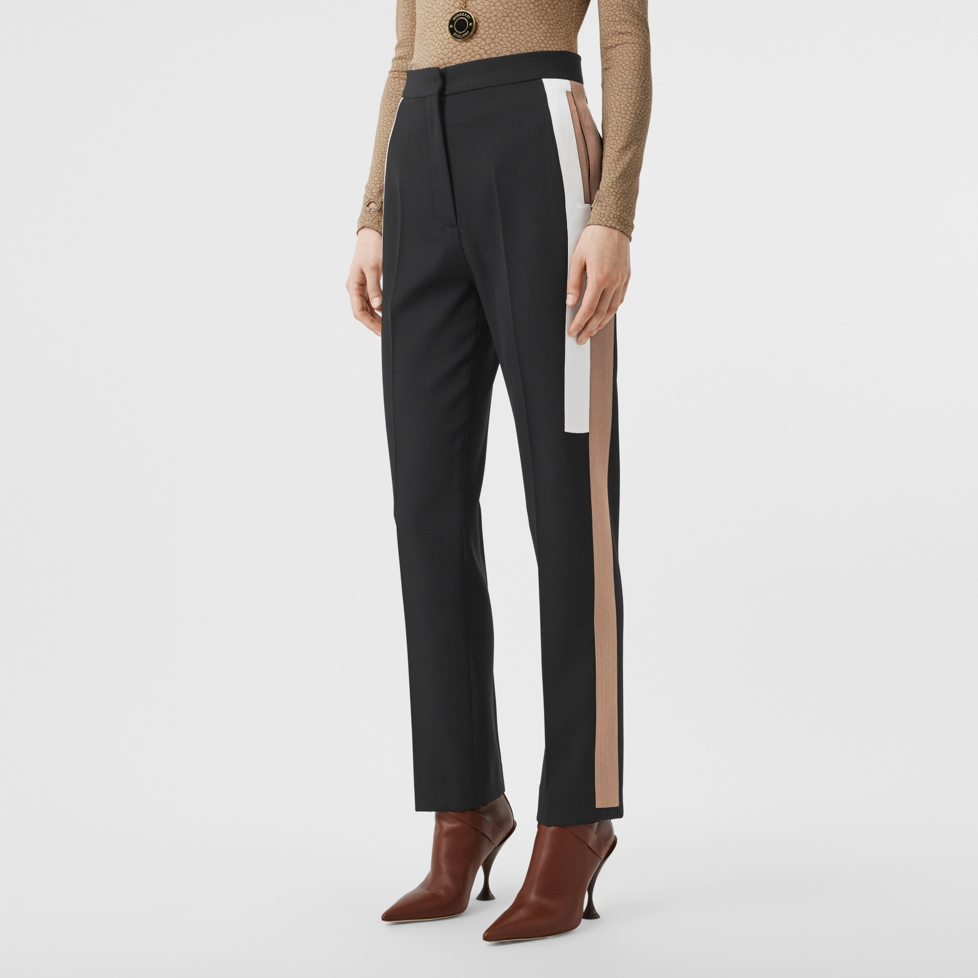 black trousers with yellow stripe