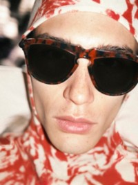 Model wears Rose print waxed cotton with sunglasses