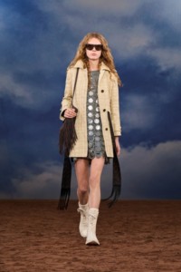 Burberry SS26 Show model Raphaella Hawkins wearing a Woven leather trench coat and a Fringed leather Equestrian Knight bag