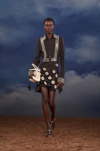 Burberry SS26 Show model Awar Odhiang wearing a Embroidered shirt dress and a Macramé knit leather skirt
