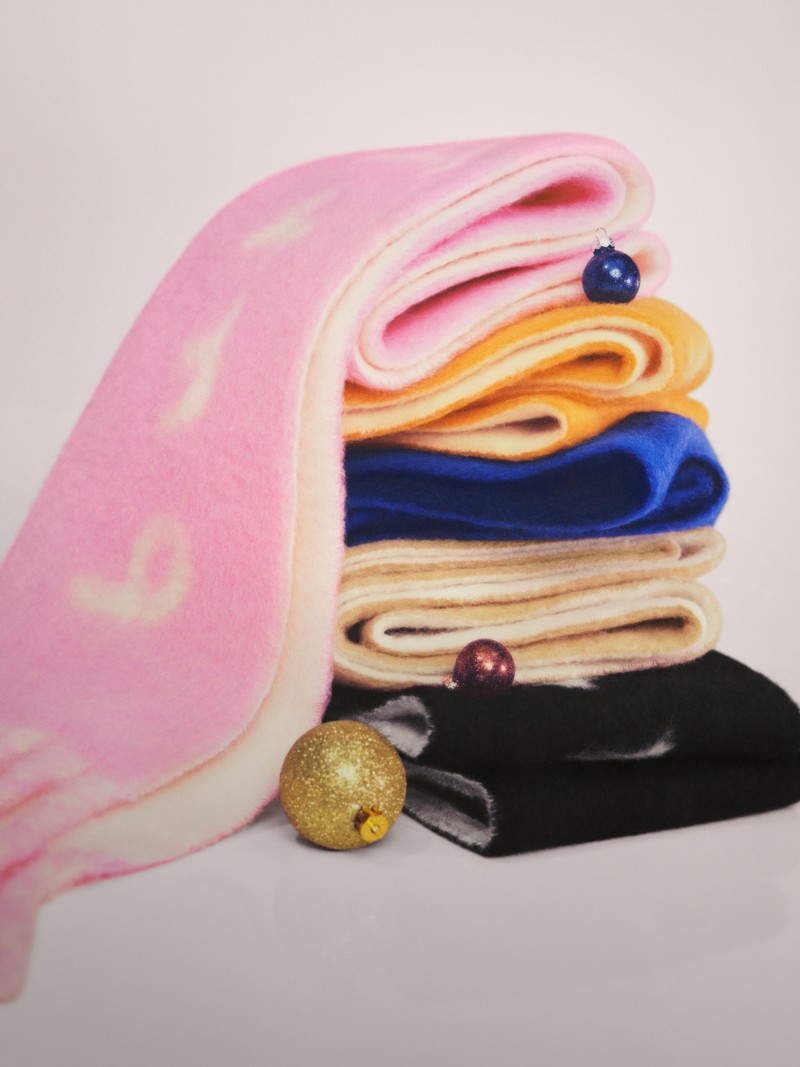 Burberry Festive Campaign featuring colourful wool scarves with burberry logo and festive decoration. 