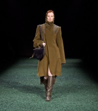 Model in Herringbone wool coat in furrow