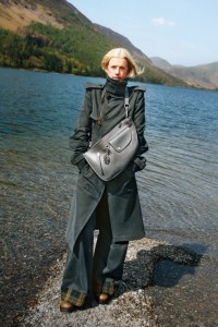 Model in Cotton Blend Moleskin Trench Coat in Cinder, wearing Shield Twin Bag in Cobble