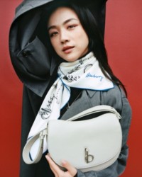 Tang Wei holding Rocking Horse Bag in colour Hunter