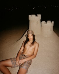 Model wearing Check Drawcord Swim Shorts with a Check Bucket hat