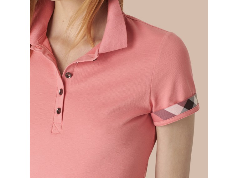 woman pink polo shirt