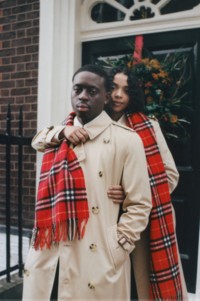 Couple wearing Burberry Trench Coat with Cashmere Check Scarf in Red.