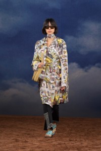 Burberry SS26 Show model Qisi Feng wearing a Tarot card print silk trench coat and a Check perforated suede Tavistock Bag