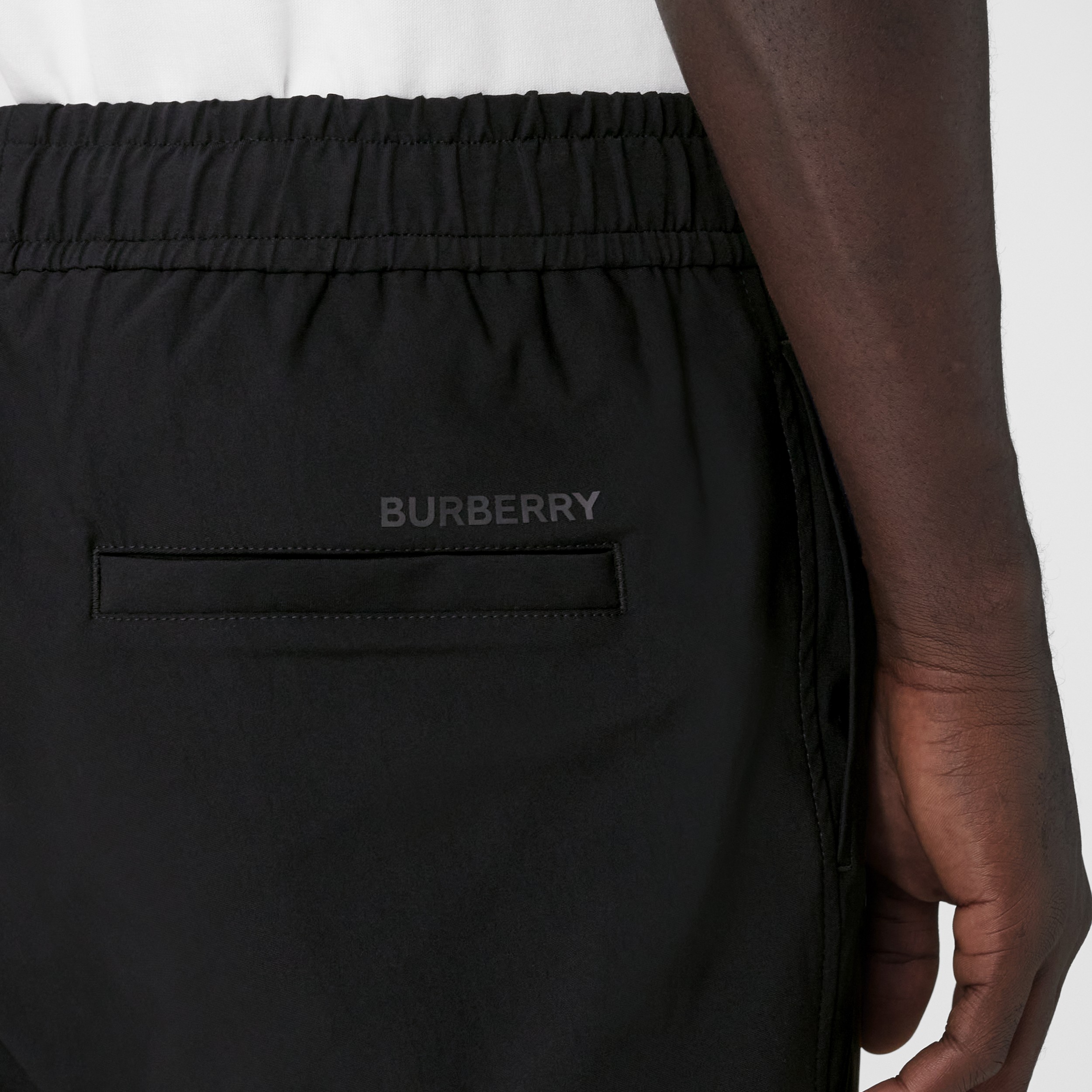 Logo Print Stretch Nylon Trousers in Black - Men | Burberry® Official - 2