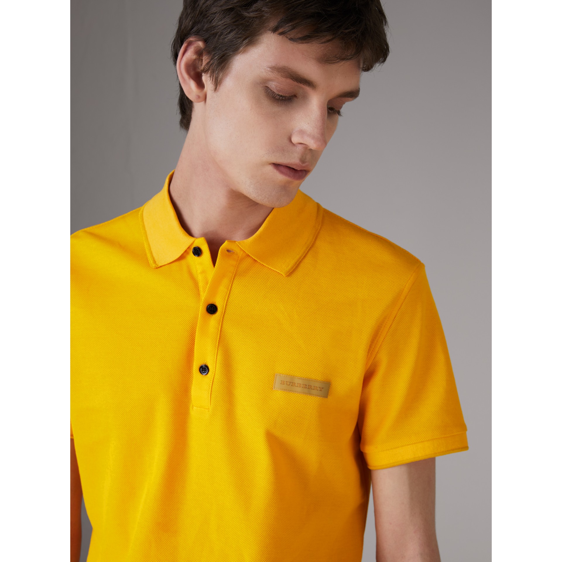 yellow burberry polo