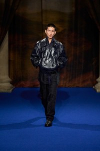 Long Li wearing embossed leather trench jacket, pyjama trousers and boots