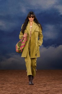 Burberry SS26 Show model Parvesh Mudgal wearing a Cotton coat and a Check leather Bridle tote