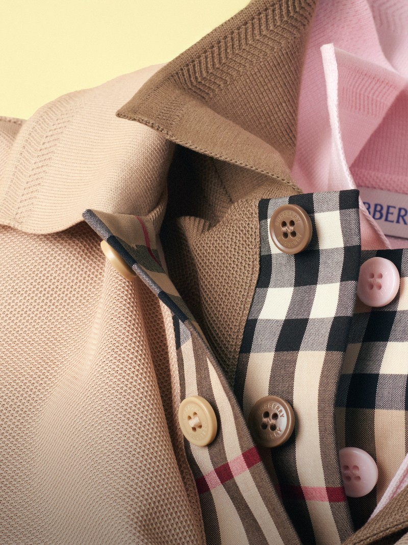Image of three Cotton Polo Shirts, featuring the colour Soft fawn beige with check trim detailing. 