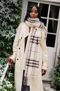 Shot of model Naomi Campbell wearing Burberry Trench Coat stood on steps outside of a house