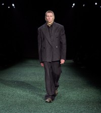 Model in Pinstripe wool double-breasted tailored jacket in black