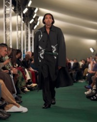 Model wearing Knight hardware print car coat.