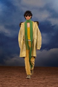 Burberry SS26 Show model Max Everist wearing a Fringed check coated parka and a green Knitted scarf