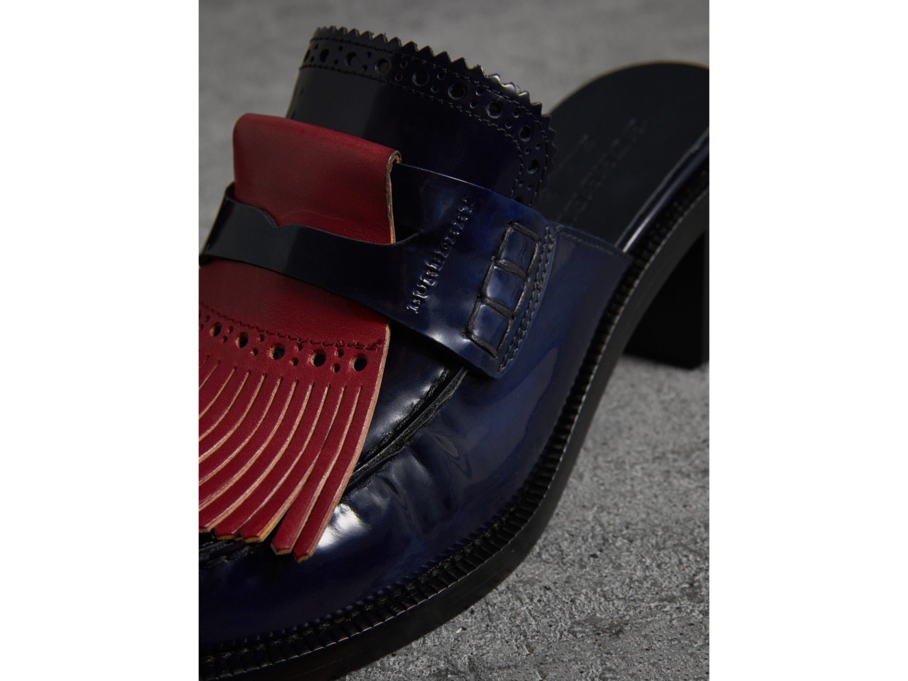 contrast kiltie fringe leather block-heel mules in navy - women
