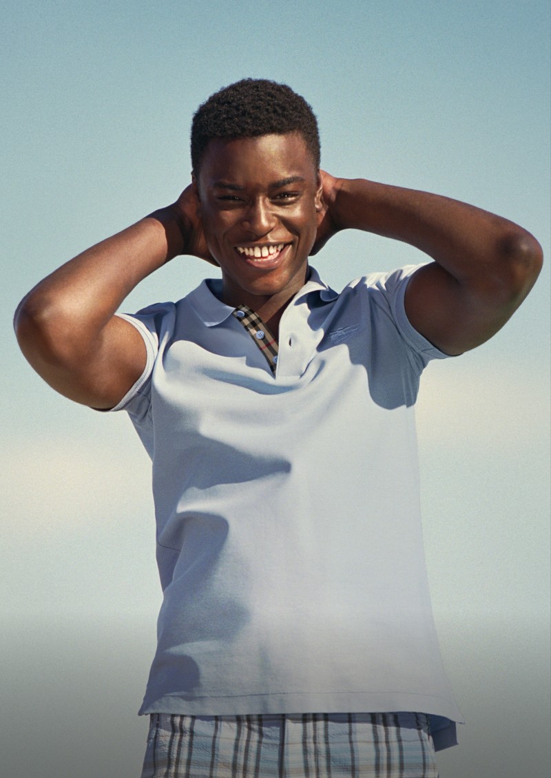 Shot of model, wearing the Burberry Cotton Polo Shirt in colour Cornflower blue