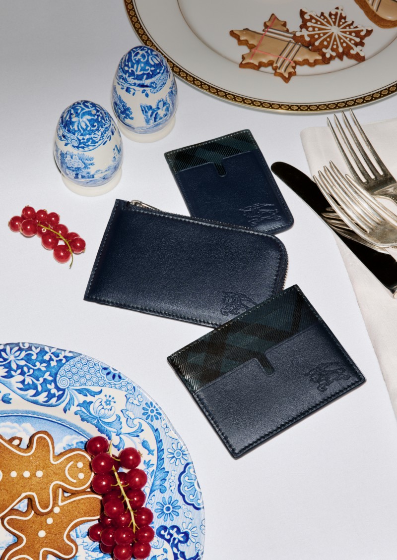 Burberry Festive Campaign featuring Men's Check Wallets on a dinner table. 
