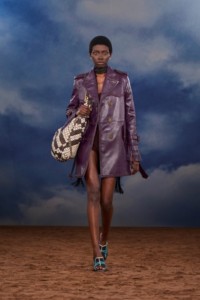Burberry SS26 Show model Binta Diop wearing a Fringed leather trench coat and a Check leather Bridle tote