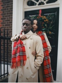 Couple wearing Burberry Trench Coat with Cashmere Check Scarf in Red.