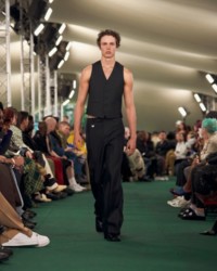 Model wearing Waistcoat and Tailored trousers.