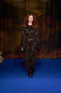 Karen Elson wearing Vine bead-embellished silk blend lace dress in chocolate brown, leather Cavalier boots in treacle brown, gold-plated Horse hoop earrings and leather boots in truffle brown.