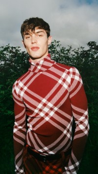 Winter 2023 Campaign featuring a model in a red check outfit