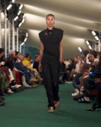 Model wearing Perforated top and Perforated trousers.