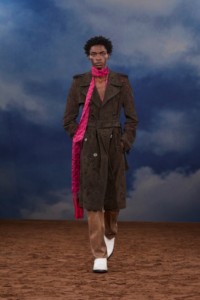 Burberry SS26 Show model Ahmed Richards wearing a Paisley perforated suede trench coat and Leather Ledger boots