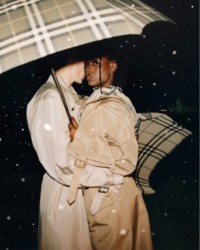 Couple wearing Burberry Trench Coat and holding Check Folding Umbrella in colour Lichen