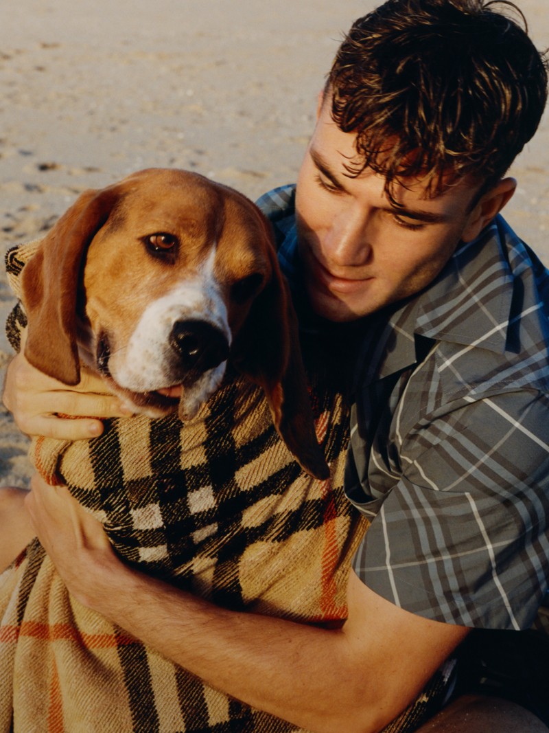 Model wearing Relaxed Fit Check Cotton Shirt in Pewter holding a dog in a Burberry Check towel
