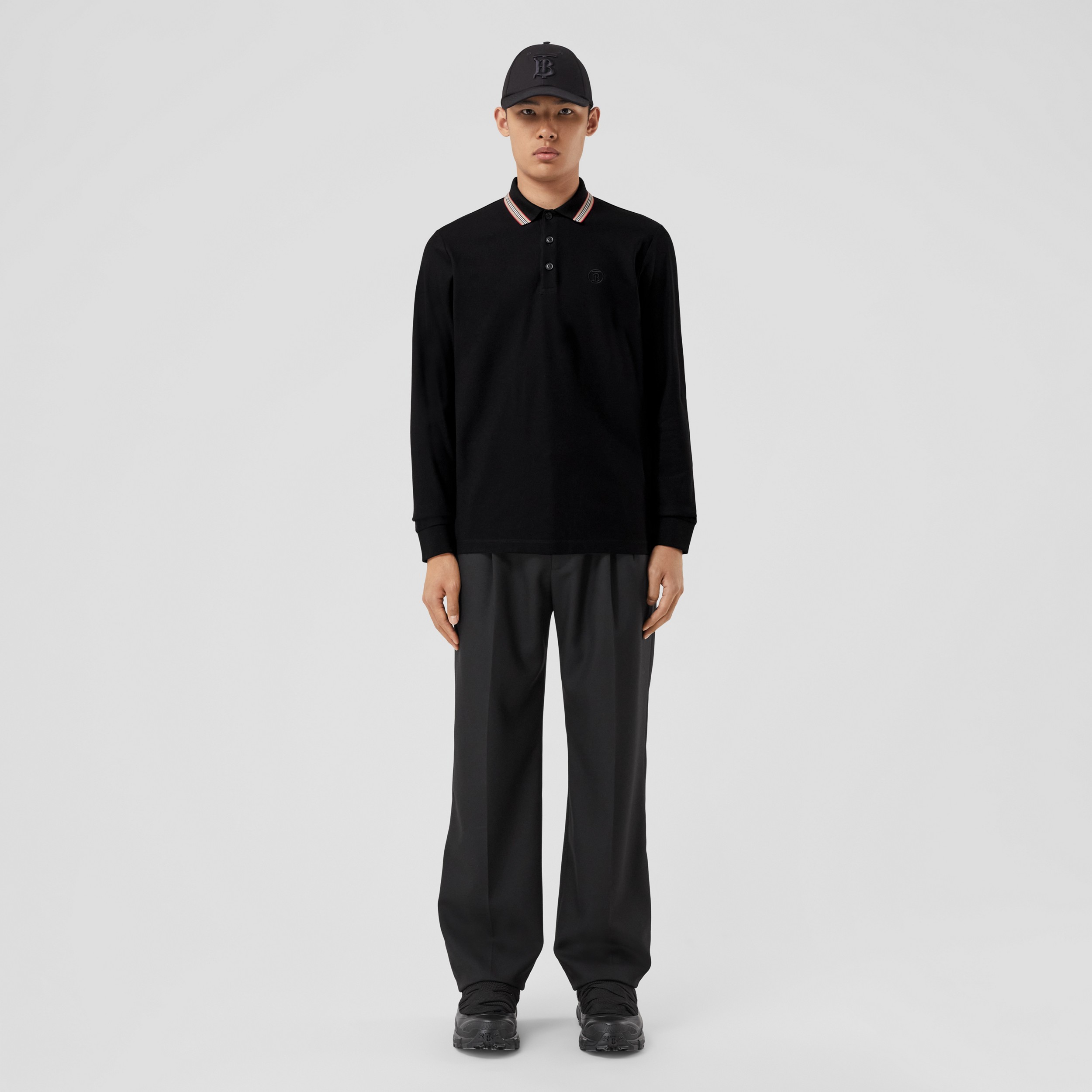Camisa polo de mangas longas em algodão com colarinho com listras icônicas (Preto) - Homens | Burberry® oficial - 1