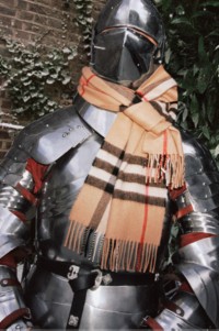 Burberry Festive 2025 Campaign featuring the Burberry Knight wearing a classic check scarf. 