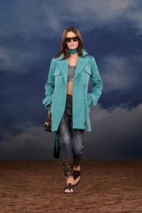 Burberry SS26 Show model Mel Van Roemburg wearing a blue Cotton coat and a Macramé knit top