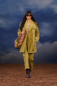 Burberry SS26 Show model Parvesh Mudgal wearing a Cotton coat and a Check leather Bridle tote