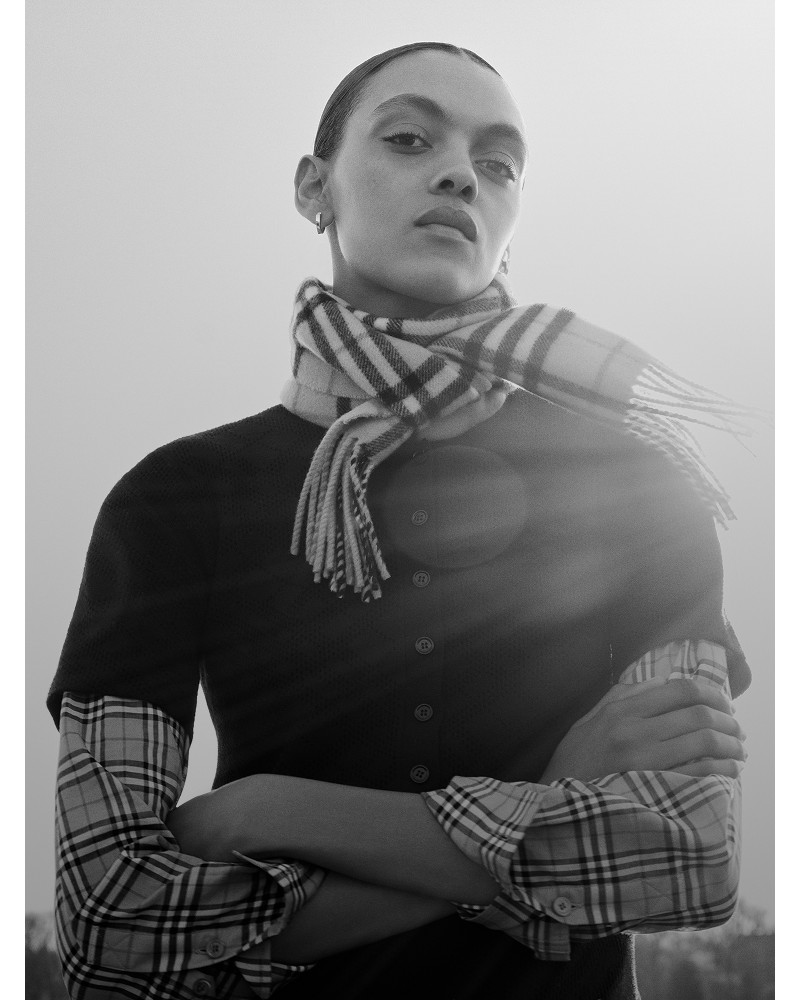 Shot of a model wearing Burberry Check Scarf, with Burberry Check Shirt under a buttoned up top