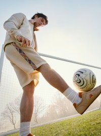 Bright featured in the Burberry A Good Sport 2026 Campaign wearing Burberry Suede Knight Runner Sneakers​ in colour Flax beige/pumpkin orange