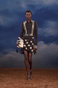 Burberry SS26 Show model Awar Odhiang wearing a Embroidered shirt dress and a Macramé knit leather skirt