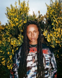 Winter Campaign 2023 featuring a model wearing a long sleeve top with a swan graphic