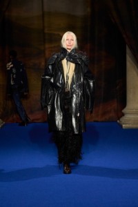 Kirsty Hume wearing leather parka, beaded lace dress and boots