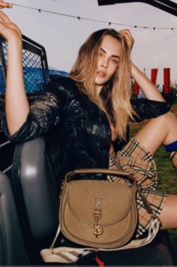 Model and actress, Cara Delevingne featured with the Small B Clip Messenger Bag in colour Sweep