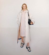 Model wearing the car coat and rose print viscose dress in cameo, styled with the Python print leather Stride pumps in serpent.