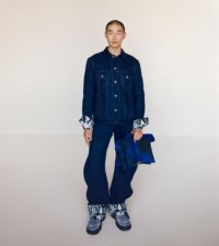 Model wearing Denim jacket and jeans in indigo blue, with Check Pillow bag in knight and Creeper shoes in salt.