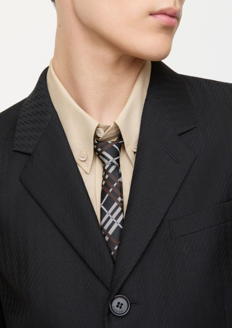 Shot of model, wearing the Skinny Check Silk Tie in colour Kiln brown