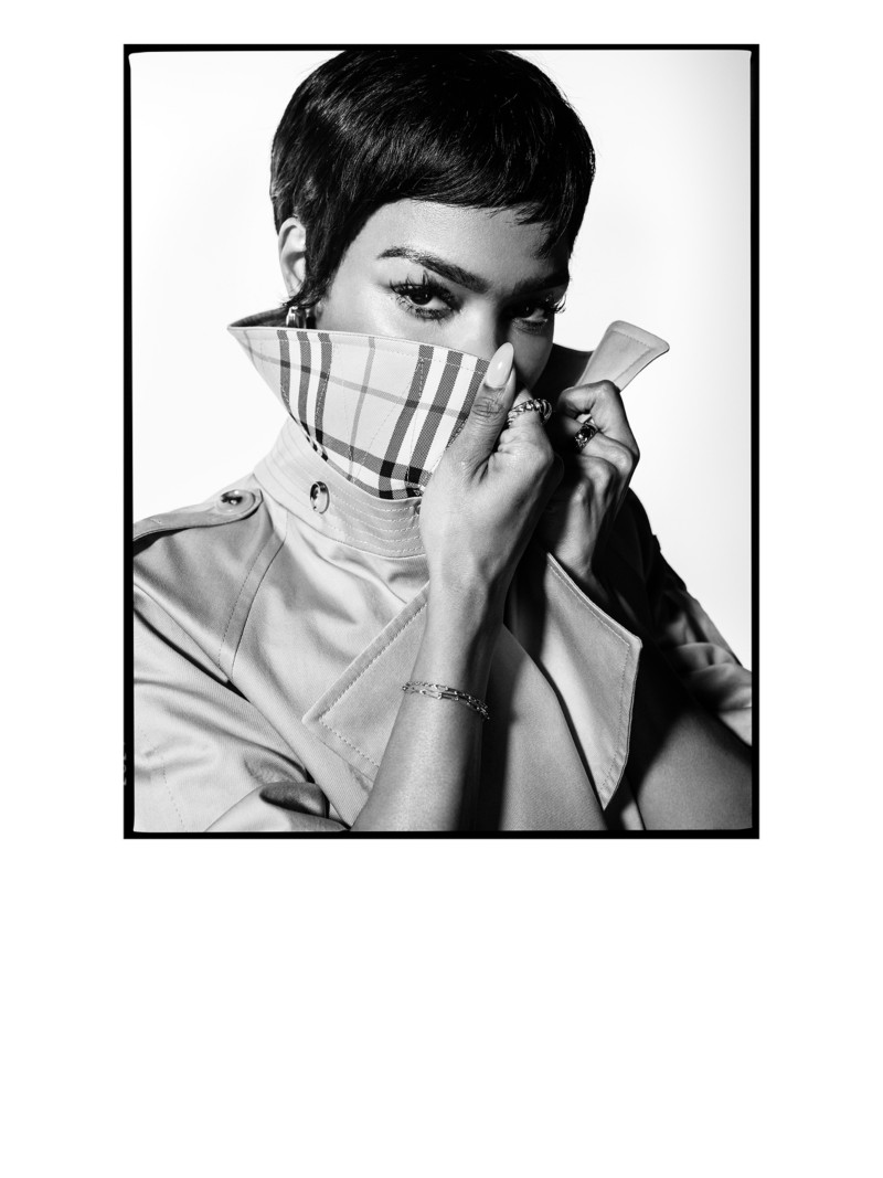 Close up shot of Actress Teyana Taylor wearing Burberry Fitzrovia Trench Coat, showing the details of the Burberry Check collar design when lifted up.