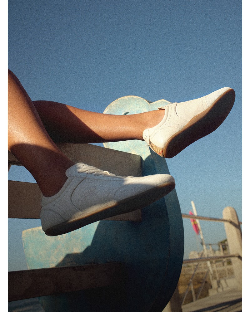 Shot of model, wearing the Leather Knight Runner Sneakers, in colour Dove Beige 
