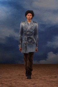 Burberry SS26 Show model Amir Ogumsi wearing a Coated denim trench coat and Corduroy trousers