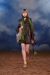 Burberry SS26 Show model Thelma Almqvist wearing a Fringed leather trench coat and a Fringed leather Equestrian Knight bag
